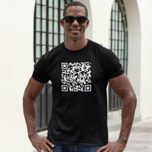Black T-shirt featuring a large QR code that leads to a humorous webpage with the text 'We've been trying to contact you about your car's warranty!