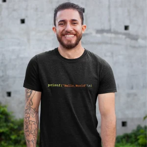 Black T-shirt featuring a programming-themed design with the text 'printf("Hello, World\n");' in colorful code style.